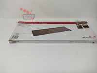 Plaque de cuisson en fonte Grandhall dans sa boîte d'emballage.